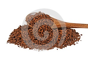 Instant coffee grains in wooden spoon on white background