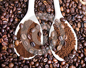 Instant coffee in spoon on coffee beans