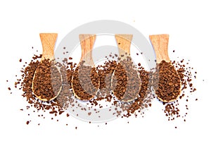 Instant coffee in wooden spoon on white background