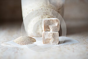 Instant and fresh raw yeast and sourdough in a jar. Natural leavening agents for baking. Close up