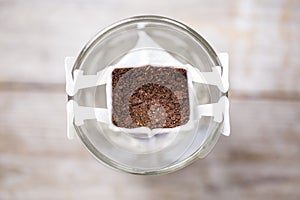 Instant freshly brewed cup of coffee, drip bag coffee