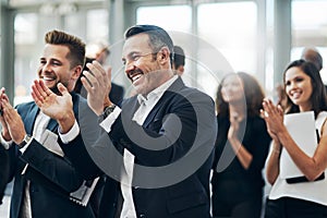 Instant gratification. a group of businesspeople applauding during a seminar in the conference room.