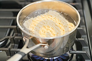 Instant noodle. Boiling water for fast-cooking instant noodle in a pot.