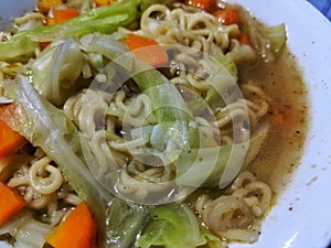 instant noodle food in bowl with mixed vegetables