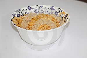 instant noodles in the bowl on wooden background - Image