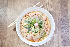 Instant Noodles with sausage with Pak Choy or Chinese Cabbage in photo