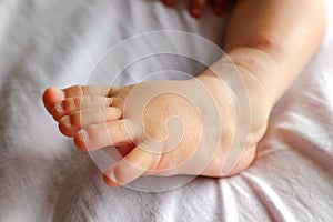Instep of a baby`s barefoot photo