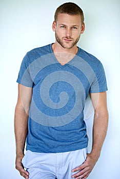 Instinctively stylish. Studio shot of a handsome young man posing against a white background.