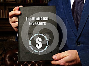 Institutional Investors inscription on the black notepad