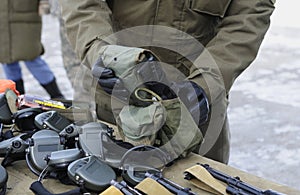 Instructing officer showing content of a portable radio for soldiers photo