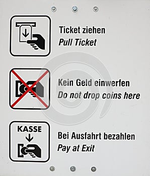 Instruction sign for parking in German and English language