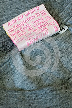 Instruction Tag on gray t-shirt