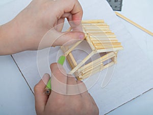 instructions for creating a house from bamboo sticks. children`s creativity, manual work, online classes. step 7. construction of