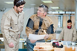 instructor with apprentice in workshop