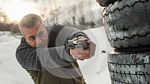 Instructor demonstrate body position of gun shooting from behind barricade