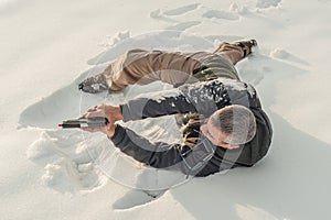 Instructor demonstrate body position of gun shooting on shooting range