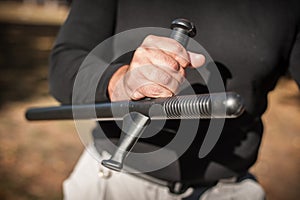 Instructor demonstrates fighting, apprehension and arrest techniques using rubber baton