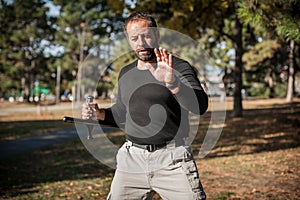 Instructor demonstrates fighting, apprehension and arrest techniques using rubber baton