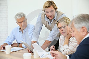 Instructor helping seniors in class