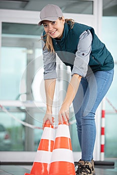 instructor sets cone driving school concept