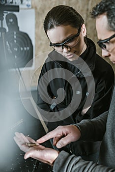 instructor showing bullet to