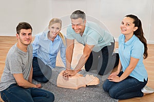 Instructor Showing Cpr Training On Dummy
