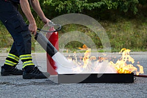 Instructor showing fire extinguisher photo