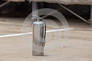 Instructor showing how to use a fire extinguisher on a training