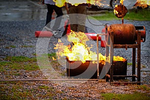 Instructor showing how to use a fire extinguisher on a training