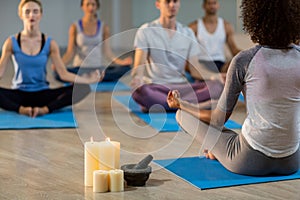 Instructor taking yoga class