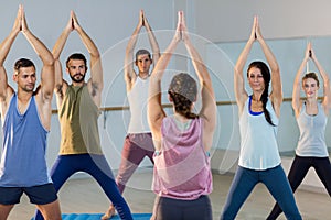 Instructor taking yoga class