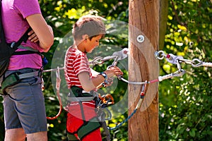 Instructor teach little boy use safety equipment