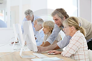 Instructor teaching seniors informatics