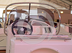 Instrument panel and steering wheel of a motor boat cockpit