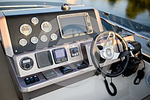 Instrument panel and steering wheel of a motor boat cockpit