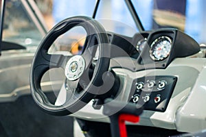 Instrument panel and steering wheel of a motor boat cockpit yacht control bridge