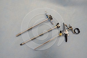 An instrument for performing a prostate resection lies disassembled on a support