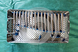 instrument tray contains rasps for a hip prosthesis operation