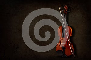 Instrument for violin and orchestra on a dark background. Place for inscription