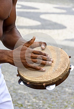 Instrumentalist playing tambourine in the streets of Pelourinho photo