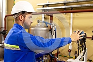 Instrumentation specialist monitors pressure