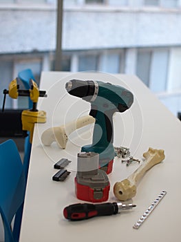 Instruments and plastic bones for orthopedic surgeries training for young doctors and medical students