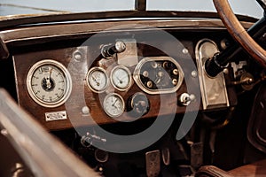Instruments and sensors of lacquered brown colored top panel of old car