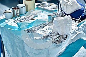 Instruments on a sterile table preparation for surgery, operating room during preparation for surgery, clean sterile