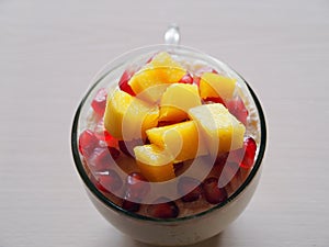 Insulated glass  cup with cheesecake and fruits