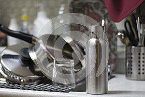 Insulated Stainless Bottle with utensils and sink kitchen background