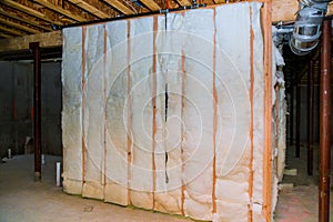 Insulation of basement with fiberglass cold barrier and insulation material