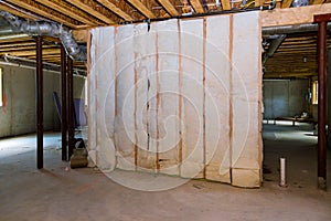 Insulation of basement with fiberglass cold barrier and insulation material