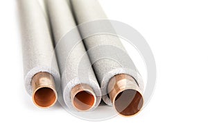 Insulation for heating pipes on a white background.