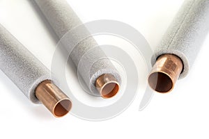 Insulation for heating pipes on a white background.